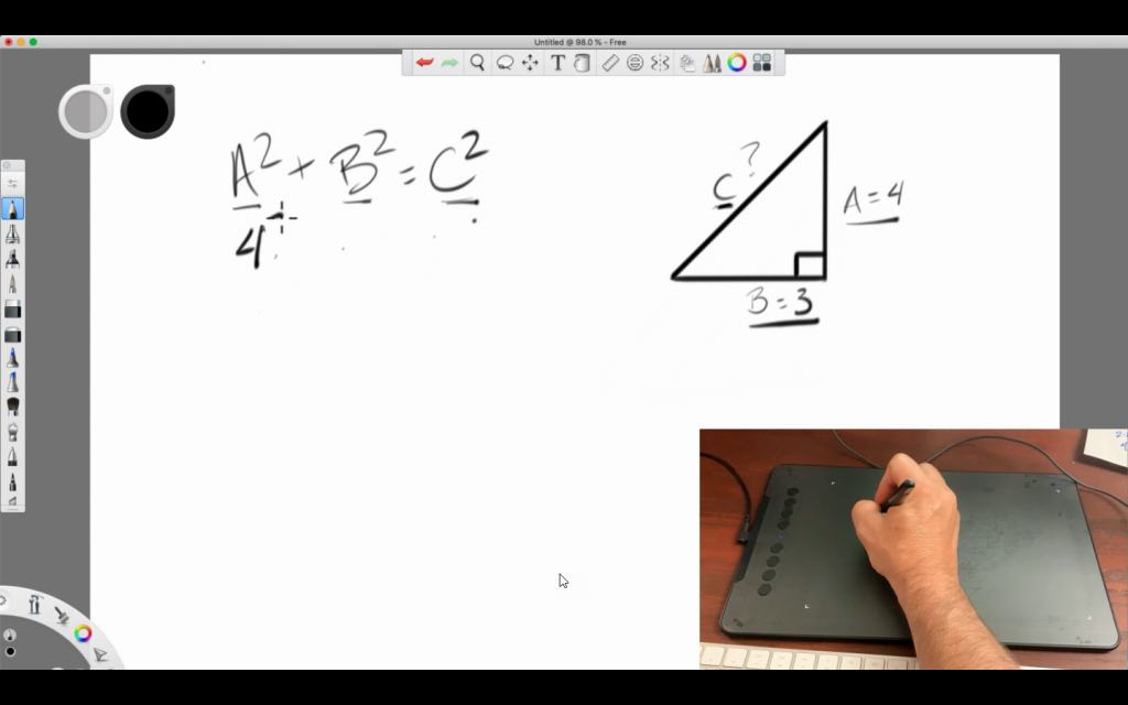 Person drawing a math equation using a tablet