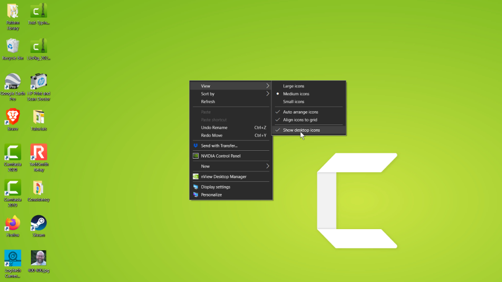 Windows desktop with right click menu open pointing to show desktop items.