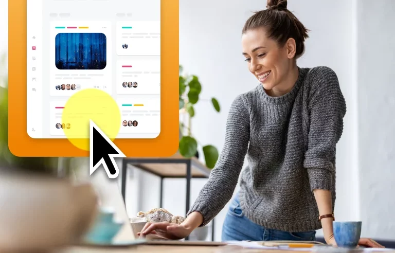 A woman using the highlight cursor feature in Camtasia to better show her cursor location on a screen recording.