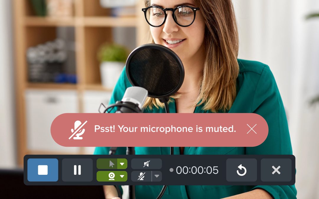 A woman talking into a microphone with a red alert saying "Psst! Your microphone is muted."