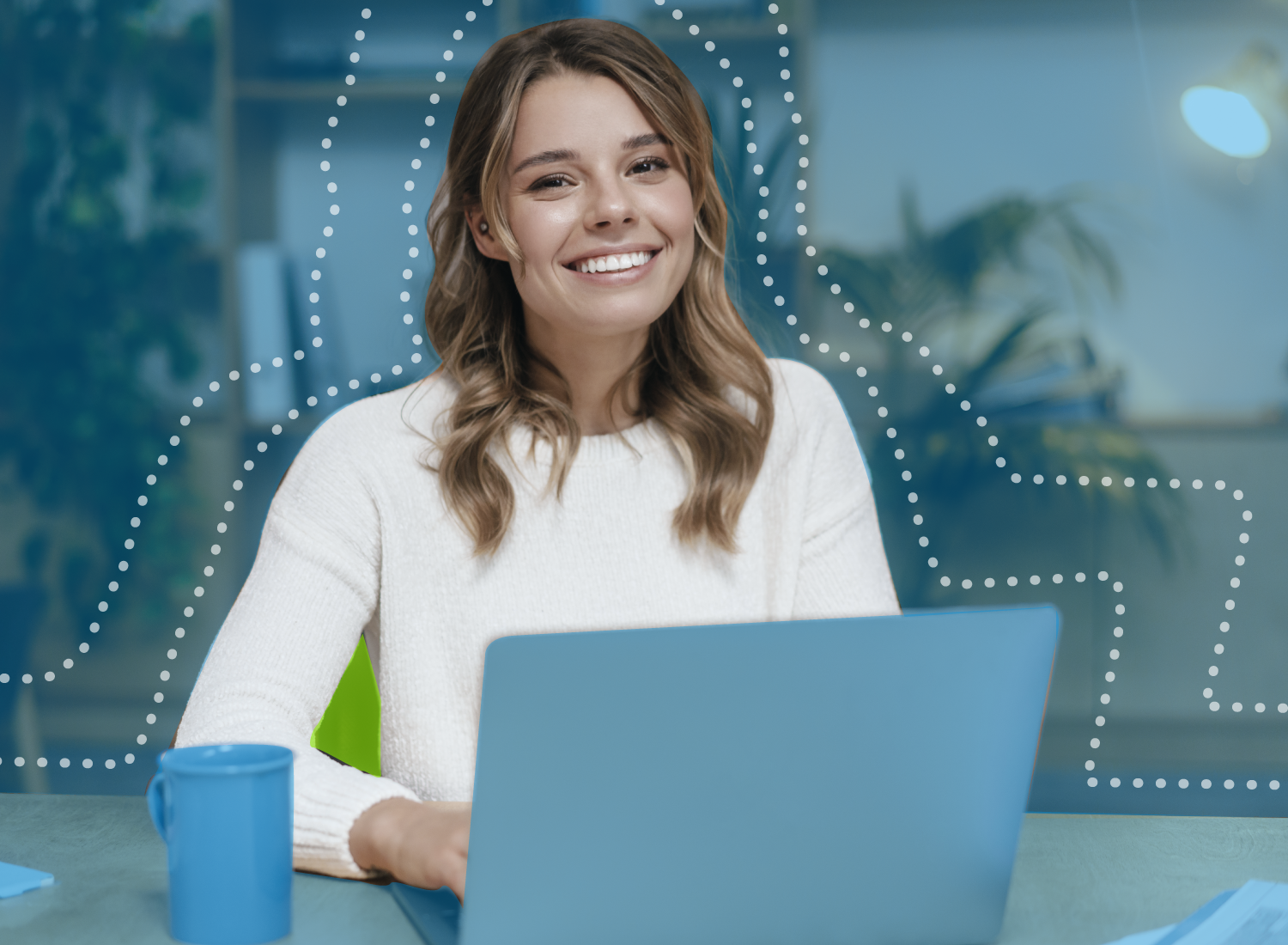 Smiling woman using a laptop for video training with visual emphasis on consistency and presence in virtual learning environments.