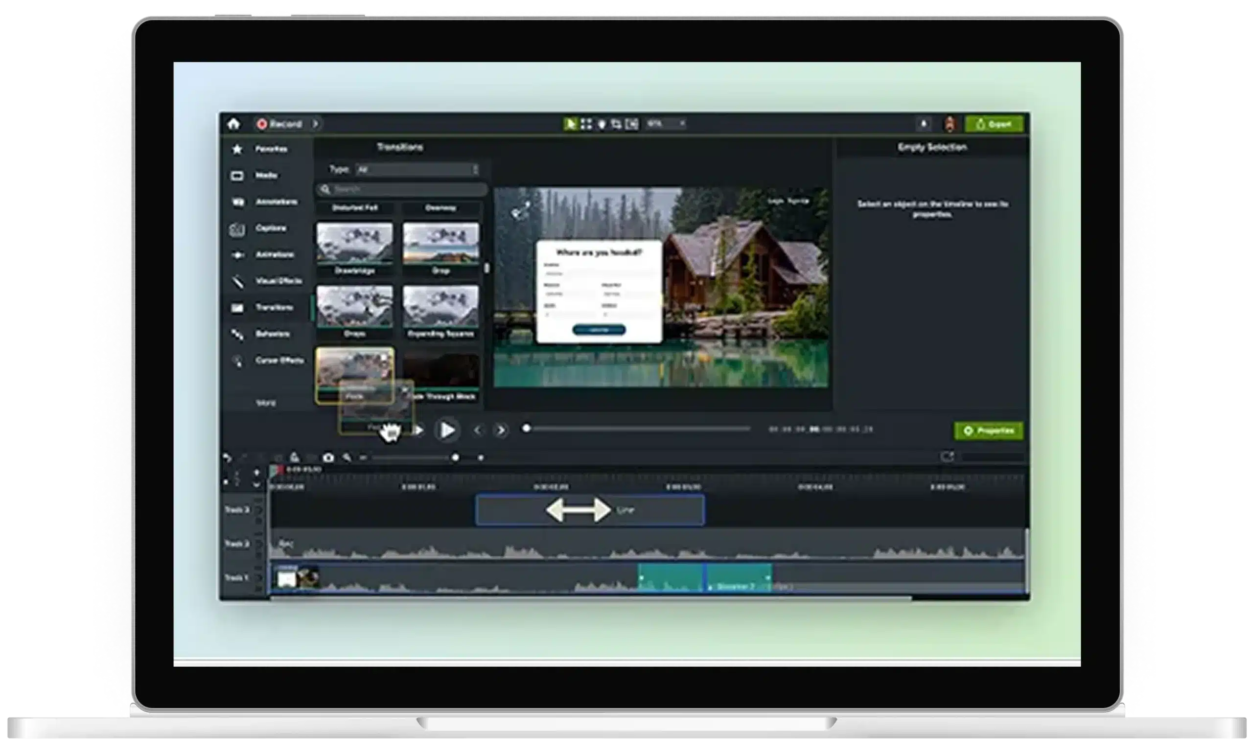 A laptop with Camtasia open to the editor with several pieces of media on the timeline being edited.