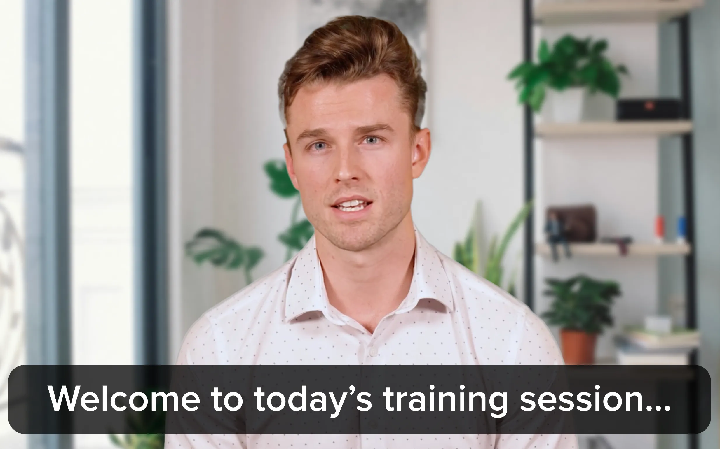 A presenter with subtitles below him that read "Welcome to today's training session" indicating a video with captions.